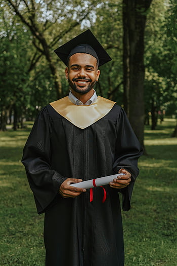 graduate, diploma, cap and gown, smiling, sunny park, outdoor graduation, academic achievement, graduation day, graduate student, graduation ceremony, graduation photo