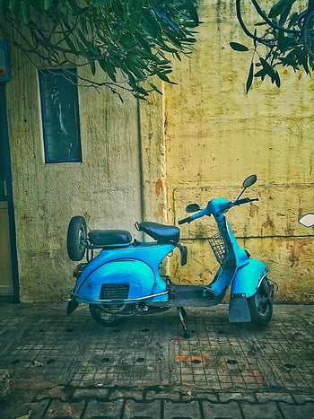 teal motor scooter, classic blue scooter, parked alley, Bengaluru India, nostalgic vibe, urban vibe, vintage scooter, street scene, outdoor setting, city life, retro style