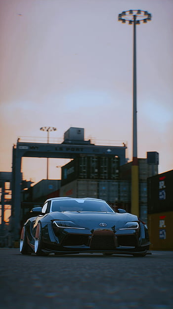 Black Toyota Supra, dynamický přední pohled, Nastavení městského přístavu, západ slunce, Černé sportovní auto, toyota supra, Urban Port, západ slunce fotografie, dynamický pohled, černé auto, Nastavení portu