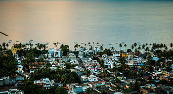 aerial photography, city, Mexican coastal town, palm trees, ocean, daylight, aerial view, coastal town, tropical town, seaside town, oceanfront town