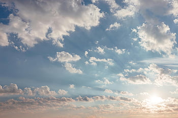 white clouds, beautiful sky, scattered clouds, sunlight streaming, perfect backgrounds, blue sky, cloud formations, natural light, serene sky, atmospheric beauty, cloudscapes