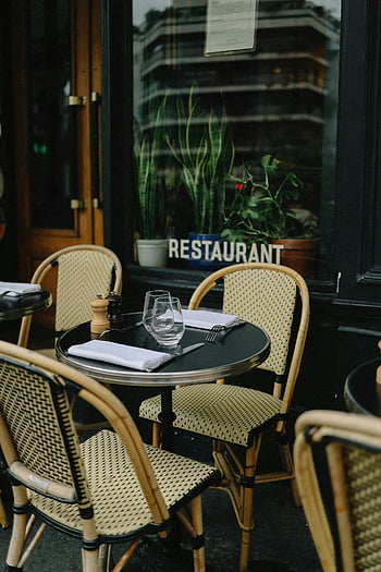 restaurant sidewalk table, outdoor dining, wicker chairs, al fresco dining, charming restaurant, tableware, outdoor setting, restaurant exterior, sidewalk cafe, dining table, restaurant chairs
