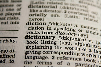 dictionary text, bokeh effect, close-up view, dictionary page, word dictionary, definition, detailed view, reference book, alphabetical listing, language terms, book listing