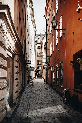 alley, cobblestone, historic buildings, old town, narrow alley, picturesque, street lamps, window boxes, European architecture, urban exploration, street signs