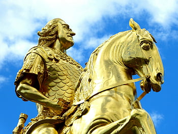 Golden Rider statue, Dresden, vibrant blue sky, close-up, golden statue, day time, horse statue, outdoor sculpture, historical monument, art, Germany