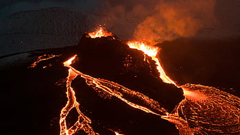 aerial photography, erupting volcano, nighttime eruption, flowing lava, night sky, volcanic eruption, aerial view, volcano, lava flow, night photography, natural disaster