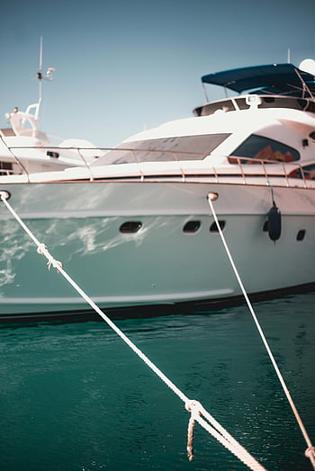 White yacht, luxury yacht, docked yacht, waterfront, close-up, ropes, boat, marina, water, outdoor, leisure