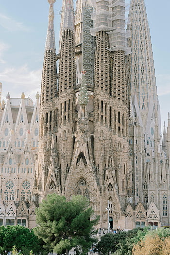 Sagrada Familia, Gothic architecture, Barcelona Spain, iconic temple, blue sky, spires, cathedral, Antoni Gaudi, religious building, historic landmark, travel destination