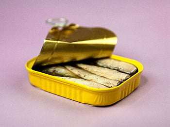 canned fish, sardines, purple background, preserved seafood, colorful tin, opened can, seafood container, yellow container, tasty fish, seafood preservation, purple surface