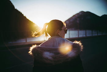 sunset, silhouette, woman, fur-collared coat, mountains, Lenggries, Germany, enjoying view, ponytail, sunglasses, scenic