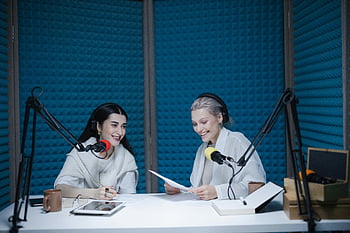 women, sitting, table, recording, podcast, soundproof, studio, professional, equipment, microphone, headphones