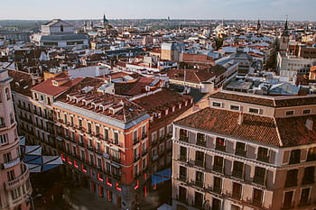 Madrid, aerial view, urban landscape, iconic rooftops, city architecture, high-angle photography, Madrid skyline, European city, rooftop view, cityscape, urban scene