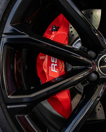 sports car wheel, red brake caliper, sleek design, car rim, tire rim, detailed view, car wheel, sports car, brake caliper, car parts, wheel design