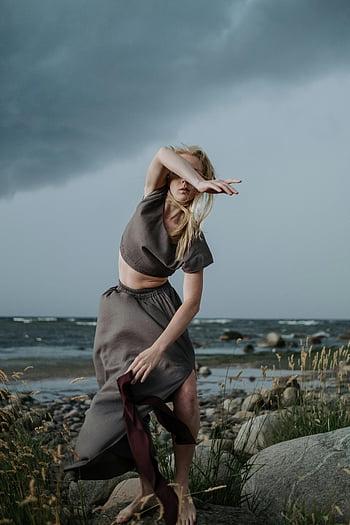 woman, gray crop top, dancing, seashore, stormy, contemporary dance, graceful, outdoor, nature, art, performance