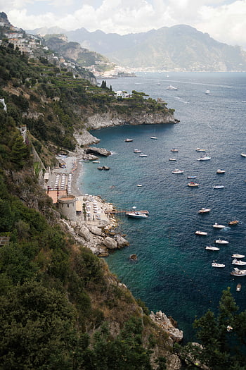 boats on water, coastal vista, Mediterranean Sea, calm water, numerous boats, blue sea, coastal view, seaside landscape, scenic coastline, boat-filled waters, tranquil sea