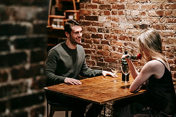 romantic date, couple dinner, cozy restaurant, rose wine, romantic setting, brick wall, intimate dinner, couple enjoying, romantic evening, cozy atmosphere, romantic couple