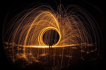 light painting, night photography, long exposure, steel wool, glowing arcs, night art, creative photography, spark photography, light trails, dark background, artistic light