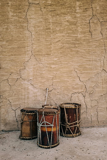 drums, Old Town, traditional drums, aged wall, cultural heritage, textured wall, three drums, wooden drums, cultural instruments, heritage drums, old town drums