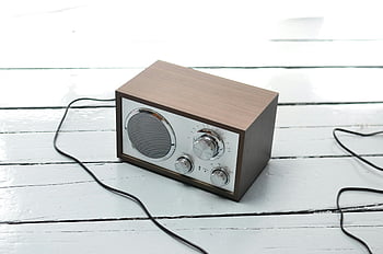 retro radio, metal front, wooden table, classic audio equipment, retro-style wooden radio, painted white surface, vintage radio, classic radio, audio equipment, wooden radio, retro audio