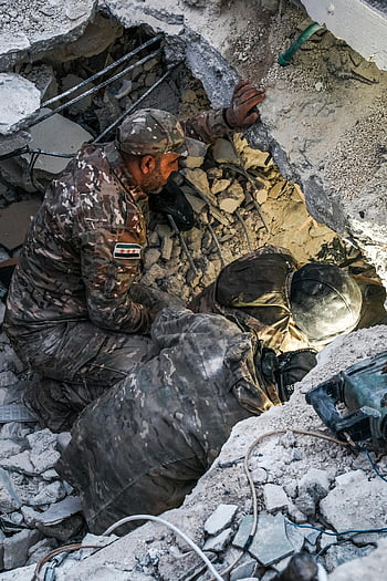 rescue workers, survivors, rubble, Jindires, Aleppo, earthquake, destroyed building, search and rescue, disaster relief, emergency response, natural disaster