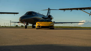 luxury sports car, private jet, airport tarmac, Illinois, sleek yellow car, parked car, private aircraft, jet on tarmac, luxury vehicle, high-end car, private transportation