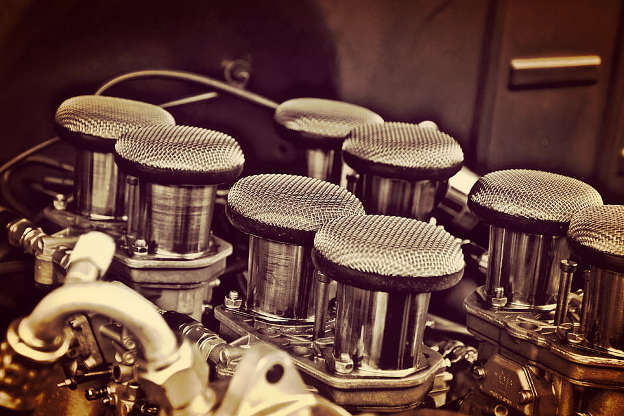 car engine, air filters, vintage car, automotive parts, mechanical components, engine bay, classic car, car restoration, car enthusiast, automotive history, car maintenance