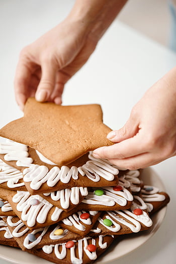 peberkager, julebagning, ferie bagning, Cookie -dekoration, stjerneformet cookie, brun cookie, hvid glasur, Festlige cookies, julekager, bage temaer, nærbillede skudt