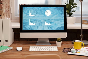 home office, desktop, plant, eyeglasses, wooden desk, stylish setup, workspace, computer monitor, keyboard, mouse, office supplies
