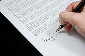 hand signing, formal document, fountain pen, agreement, close-up, white printer paper, signature, document signing, fountain pen writing, formal agreement, hand writing