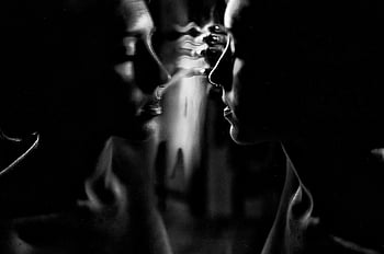 black and white, woman reflection, contemplation, serenity, thoughtfulness, dreamy, eyes closed, touching glass, captivating photo, artistic portrait, monochrome photography