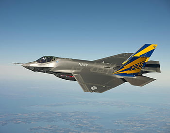 Navy F-35, fighter jet, clear blue sky, aerial view, grey blue yellow, military aircraft, F-35 fighter plane, Navy aircraft, soaring skies, stunning aerial, fighter jet flying