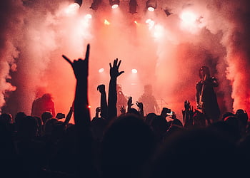 concert, rock band, live performance, enthusiastic audience, vibrant stage lights, dynamic scene, music event, stage atmosphere, crowd energy, live music, concert lighting