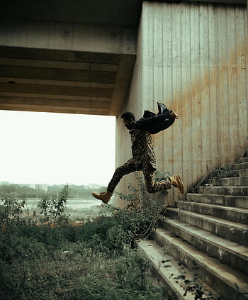 man-jumping-stairs-urban-setting-mid-air-dynamic-shot-freedom-energy-leaping-concrete-steps-outdoor-scene-thumbnail.jpg