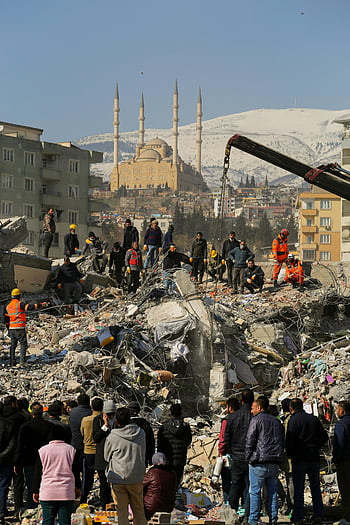 earthquake debris, rescue operations, city earthquake, mosque, snowy mountains, rubble, emergency response, disaster relief, collapsed buildings, urban disaster, rescue workers