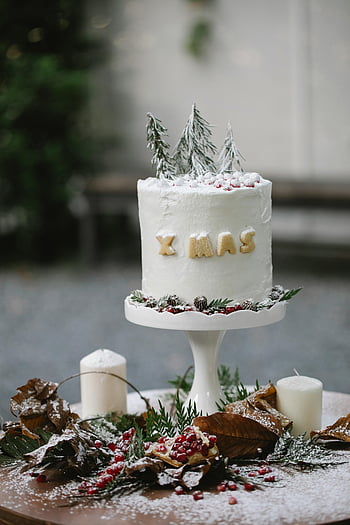 Christmas cake, chocolate glaze, berries, winter-themed decorations, holiday celebrations, elegant dessert, Xmas dessert, festive cake, Christmas dessert, winter cake, holiday cake