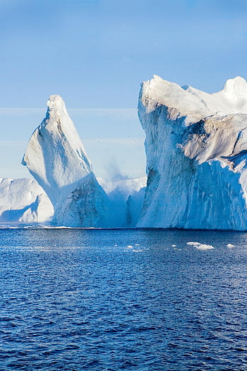 iceberg, daytime, Arctic, Greenland, clear blue sky, towering icebergs, Arctic waters, breathtaking view, natural landscape, ice formation, ocean scenery
