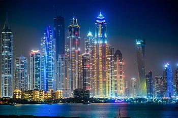 Grey high rise buildings, city skyline, night view, illuminated skyscrapers, urban landscape, modern architecture, waterfront city, tall buildings, city lights, cityscape, night scene