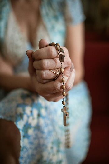 woman praying, rosary, faith, devotion, hands clasped, prayer, cross, beads, religious, spirituality, woman's hands