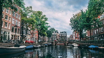 Amsterdam canal, boats parked, historic buildings, bicycles, charming view, river, parked boats, canal scene, Amsterdam scenery, canal boats, canal view