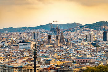 Barcelona, Sagrada Familia, aerial photography, high-rise buildings, sunset view, cityscape, iconic landmark, urban skyline, Spain, travel destination, architectural marvel
