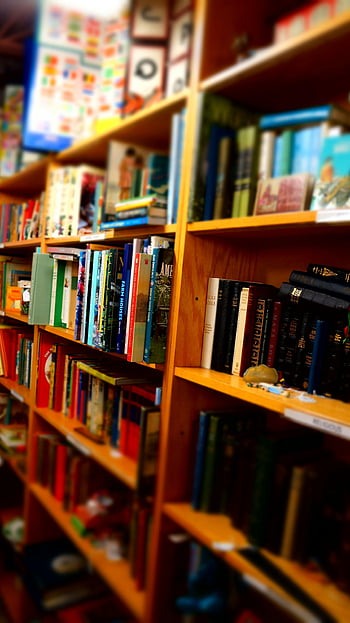 books, brown wooden shelf, indoor library, vibrant array, wooden library shelves, depth of field, book collection, indoor bookshelf, book display, library interior, book arrangement