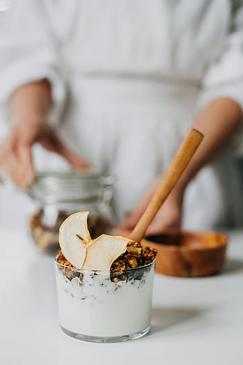 yogurt parfait, granola, apple slice, glass jar, breakfast, close-up, dessert in a glass, parfait, healthy breakfast, wooden spoon, glass container