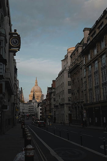 London, St. Paul's Cathedral, street view, city architecture, dusk, urban scene, cityscape, evening light, historic buildings, traffic, road