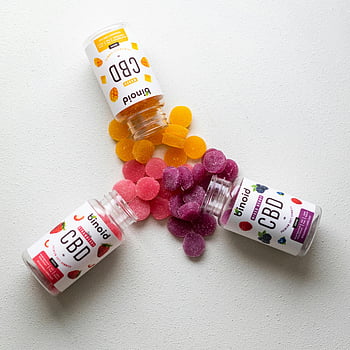 cbd-gummies-plastic-containers-colorful-cbd-gummies-studio-flat-lay-spilling-gummies-cbd-products-binoid-cbd-cbd-supplements-cbd-edibles-flat-lay-photography-thumbnail.jpg