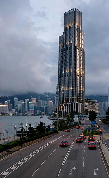 Rosewood Hong Kong, drone photography, evening view, high-rise building, city skyline, waterfront, Hong Kong, stunning view, urban landscape, modern architecture, cityscape