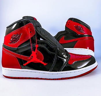 Black and Red Rubber Shoes, red and black Air Jordan, iconic design, brand logo, close-up sneakers, Air Jordan sneakers, red and black sneakers, Nike logo, high-top sneakers, Jordan brand, rubber shoes