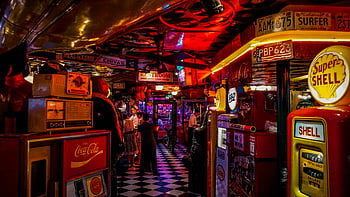 vintage arcade, retro signs, people, neon lights, arcade bar, Coca-Cola, Shell gas pump, checkered floor, vintage decor, bar interior, neon signage