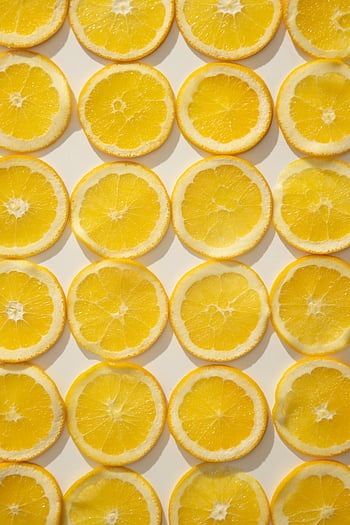 sliced citrus fruits, lemon slices, vibrant pattern, fresh lemons, appetizing backdrop, healthy food, citrus backdrop, sliced lemons, citrus fruits, lemon pattern, citrus slices