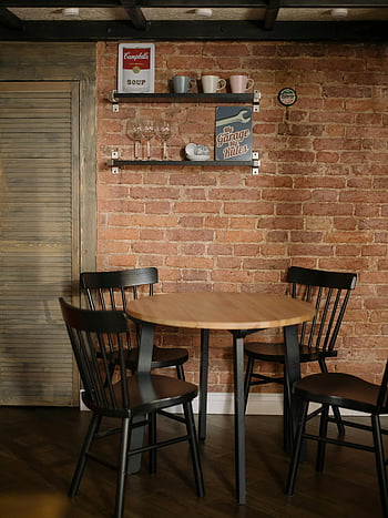 brown wooden table, chairs, cozy kitchen, brick wall, shelf decor, warm corner, wooden table set, kitchen corner, rustic decor, dining area, interior design