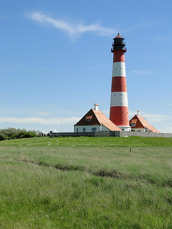 lighthouse, white and red lighthouse, grass, lush green field, sunny day, scenic view, red and white, outdoor, nature, architecture, landmark
